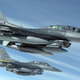Illustration for article titled This photo of flying F-16s looks so perfect I cant believe its real